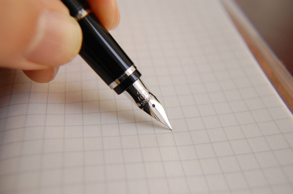 signature pen paper hand